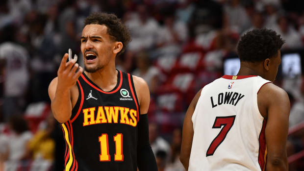 Trae Young argues a call during a game against the Miami Heat.